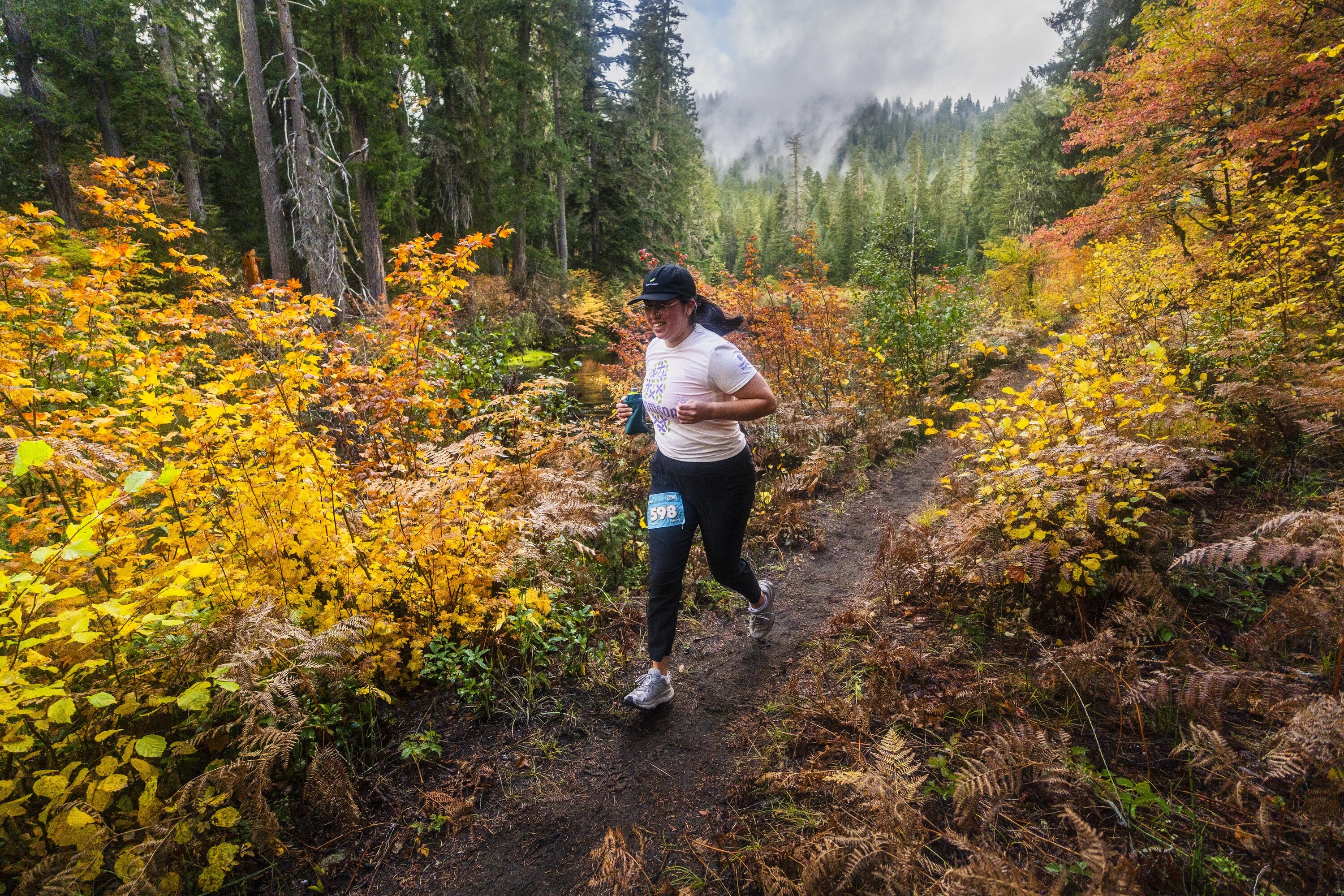 Runner moving through a fall trail race